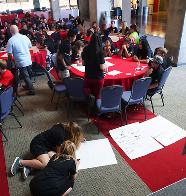 Adam Fletcher works with student leaders who are improving their schools in Arizona.